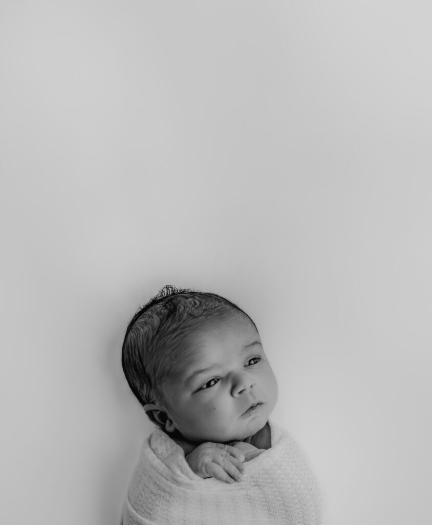 newborn baby boy posing for picture