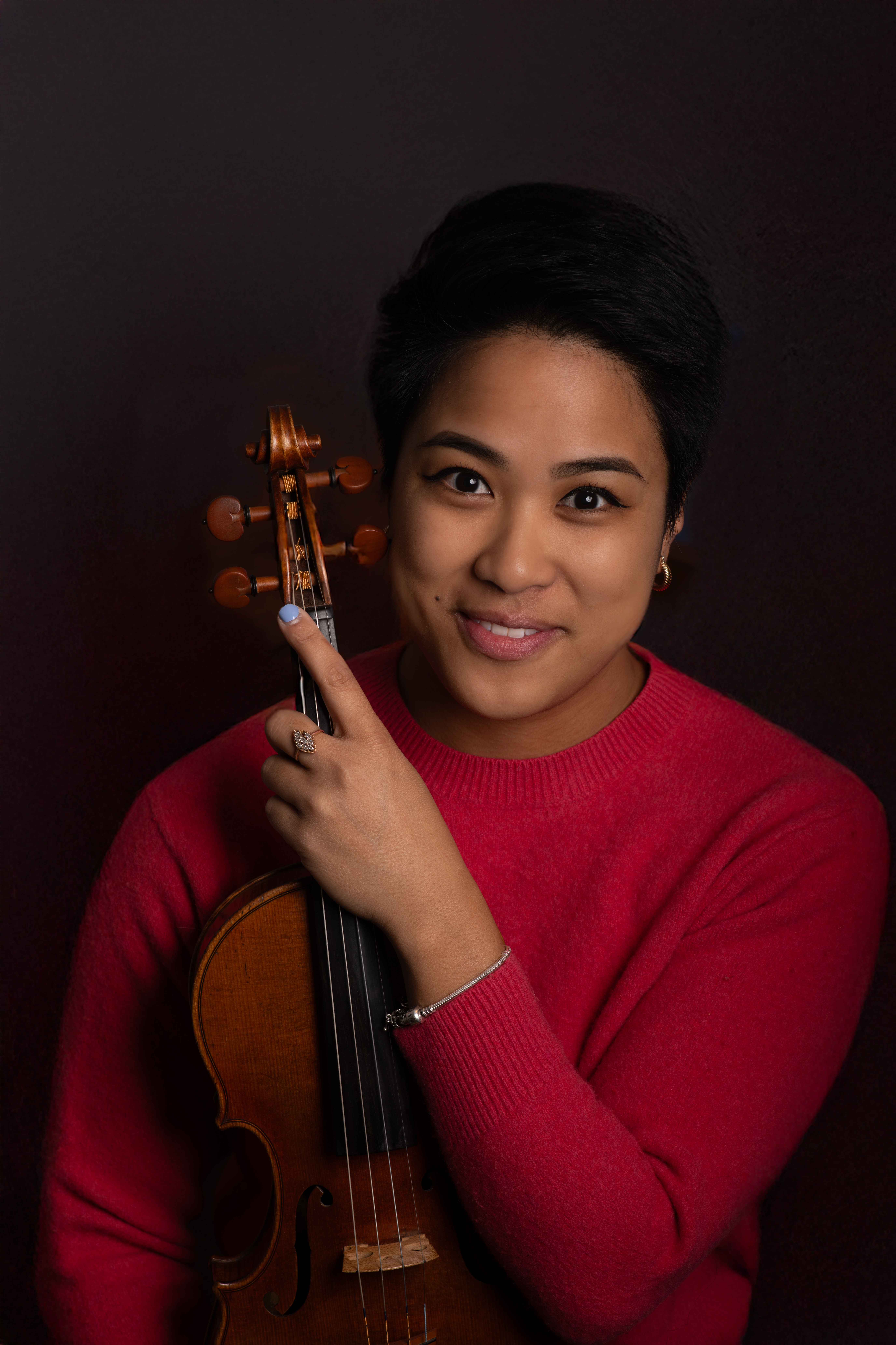Musician Artist with violin posing for studio headshot