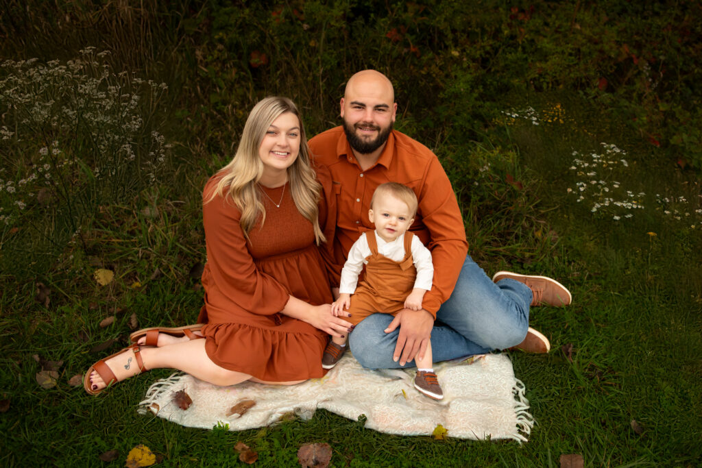 family posing for outdoor picture