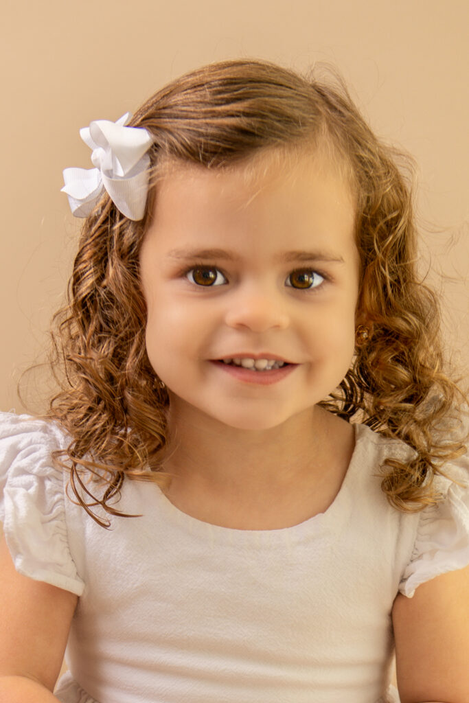 pageant photography toddler girl curly hair white bow